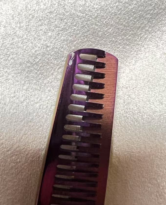 Close-up of thinning blade showing visible grinding marks on the surface