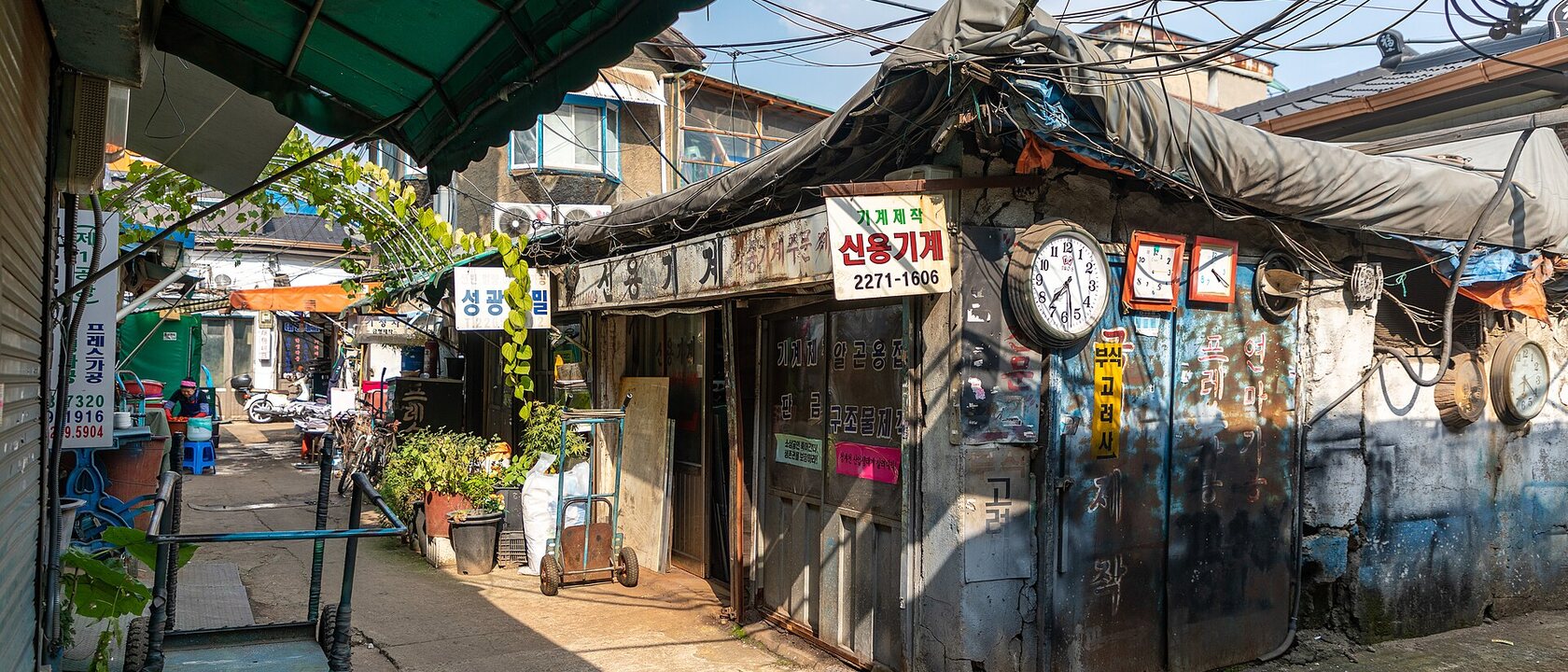 Narrow lane lined with small metalworking shops in Seoul's Sallimdong district