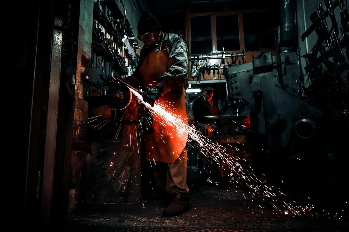 Metal workshop with tools and equipment for scissor manufacturing