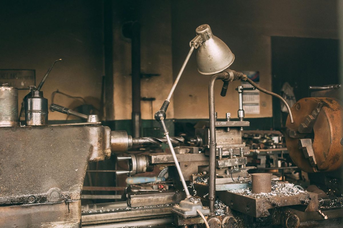 Industrial metal workshop with forging and finishing equipment