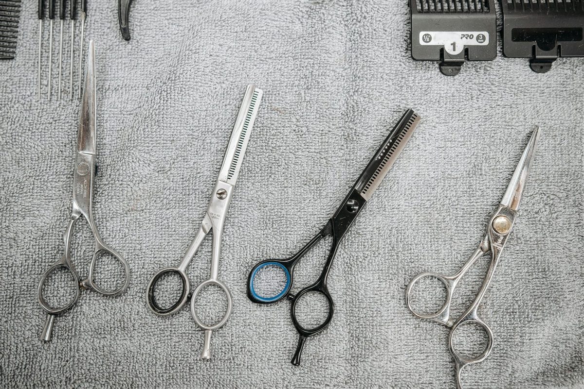 Scissors and professional maintenance tools arranged in organized layout