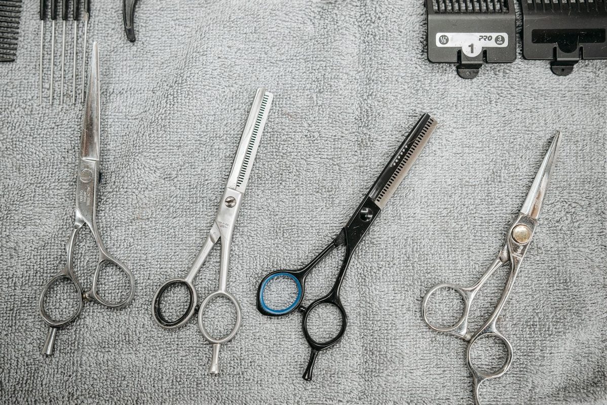 Professional scissors displayed on table for maintenance inspection