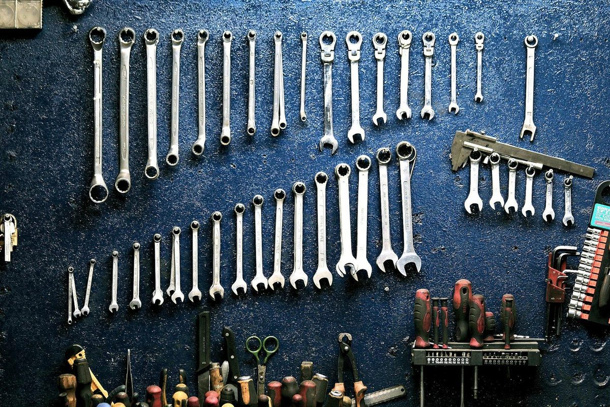 Professional tools and equipment organized for scissor maintenance