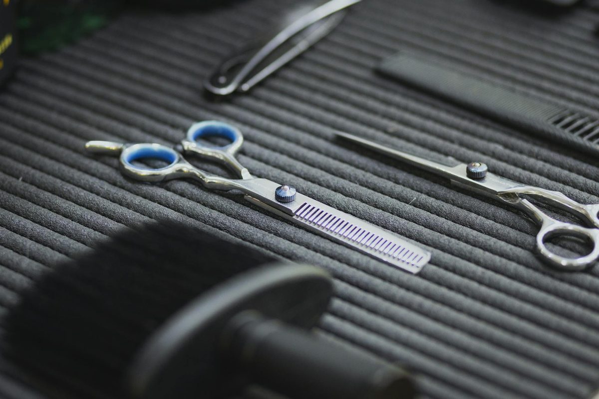 Professional scissors on table for maintenance and care inspection