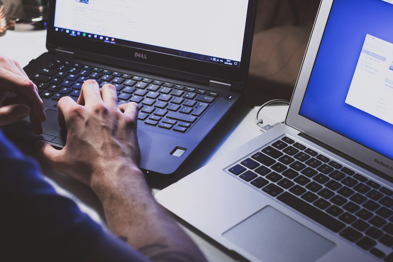 Stylist evaluating an online course on a laptop with notes