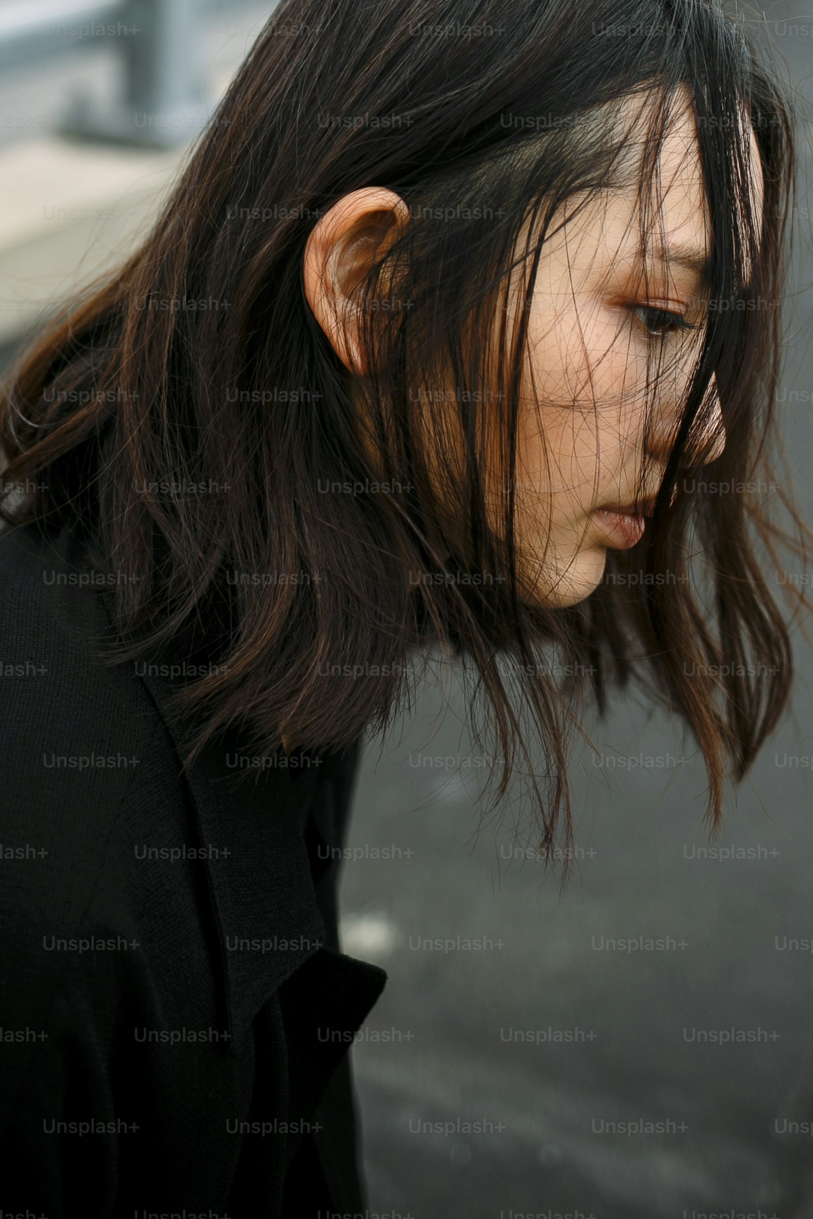Korean-inspired fashion look with trend-cut fringe