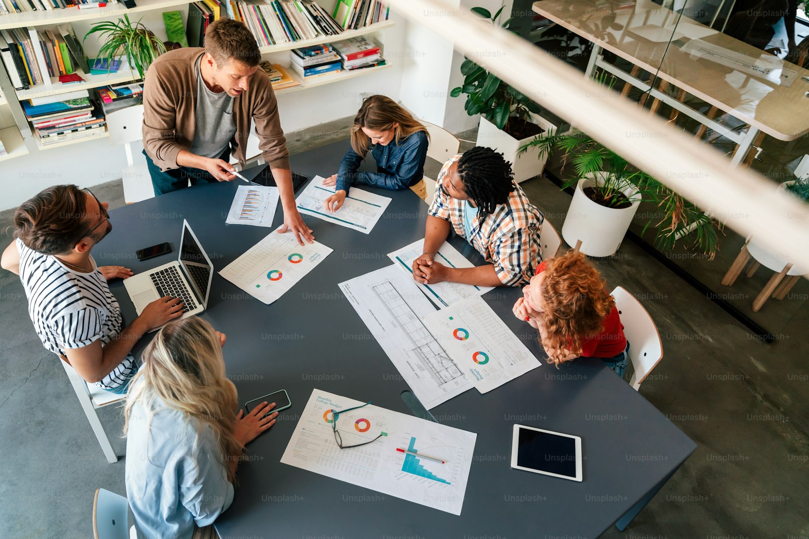 Educators reviewing student assessment rubrics in a meeting room