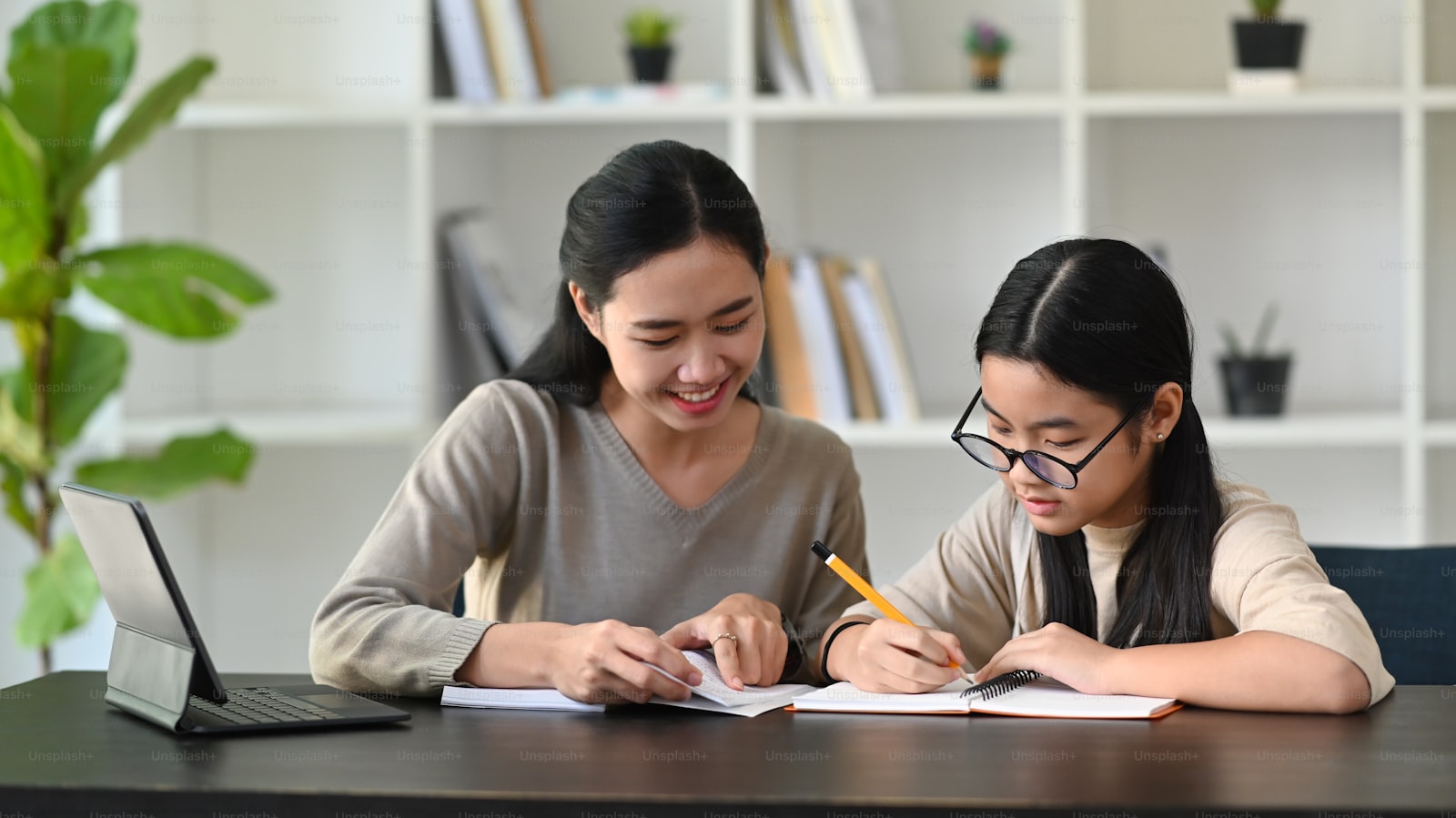 Educator guiding a stylist through a curriculum planning session
