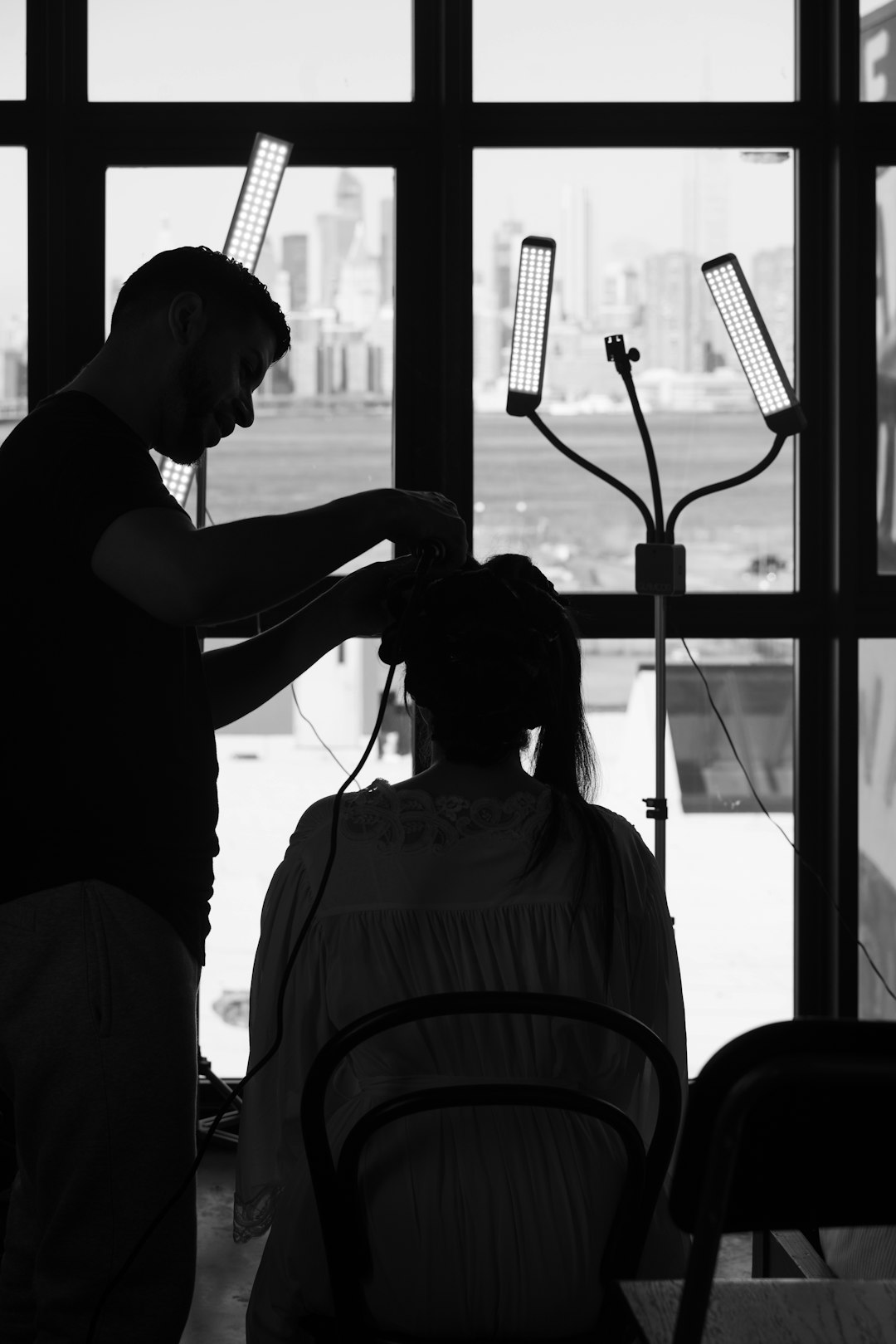 Salon team reviewing SOP binders during a training meeting