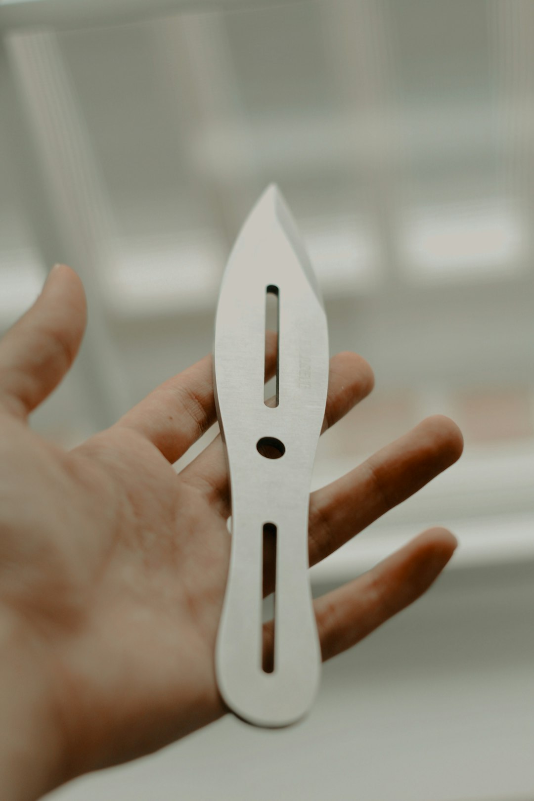 Macro view of a polished scissor blade reflecting light