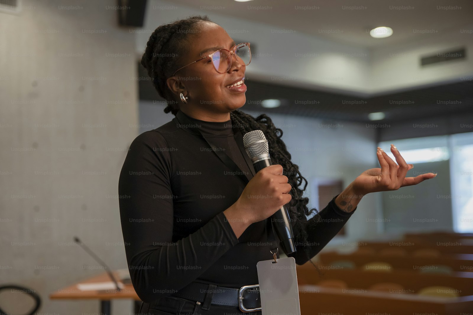 Guest artist speaking on stage with microphone