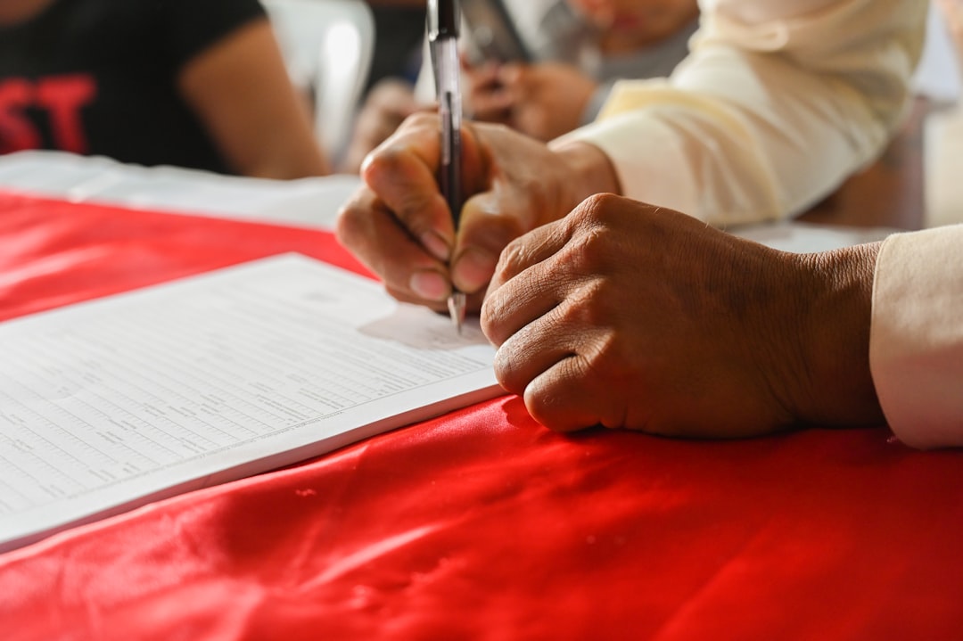 Salon owner reviewing liability documents at a workstation