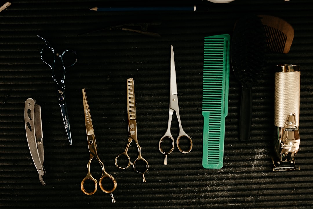 Assorted professional hair scissors arranged on a linen workstation